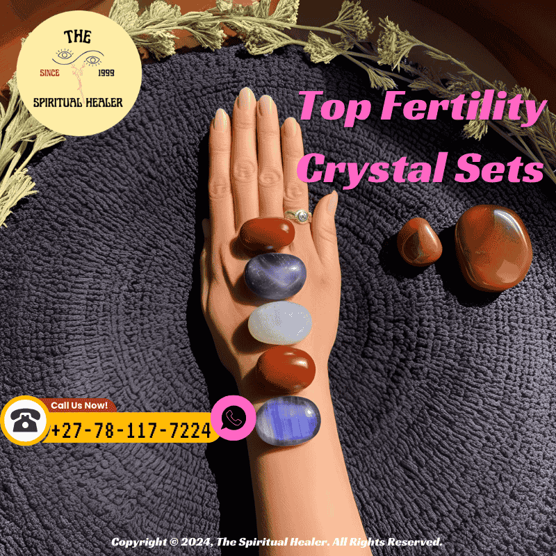 A hand placing Moonstone and Carnelian on the womb area during a healing session